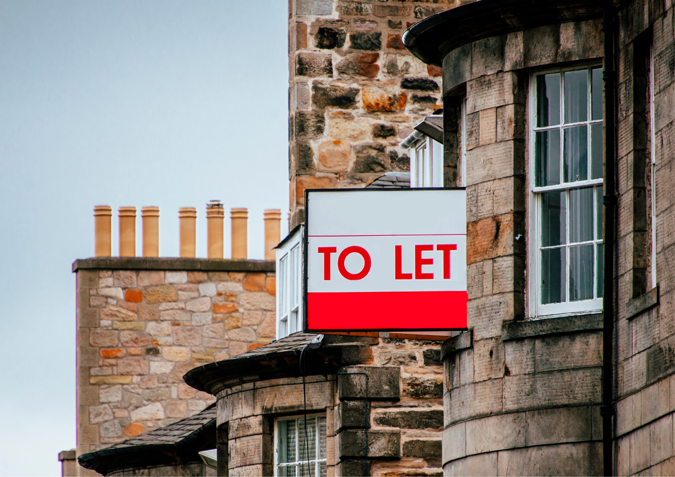 house with buy to let sign